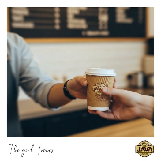A Java Lounge cup passed across the counter